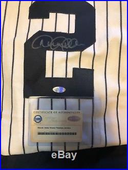 Derek Jeter Autographed New York Yankees Home Pin Striped Jersey! Steiner COA